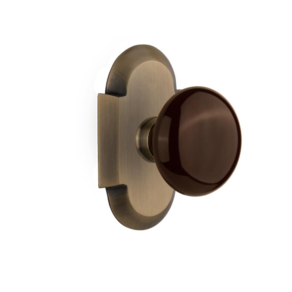 Nostalgic Warehouse COTBRN Passage Knob Cottage Plate with Brown Porcelain Knob in Antique Brass